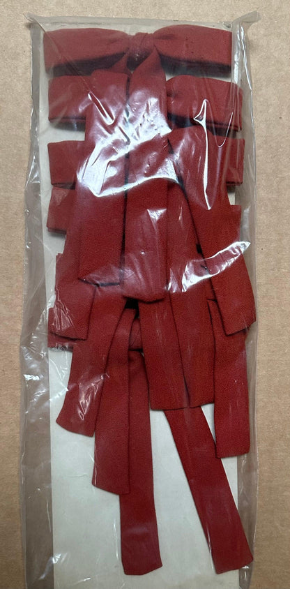 The "Colonel Ties" from Square Up Fashions are red fabric strips, ideal for a western look, conveniently packaged in a transparent plastic bag.