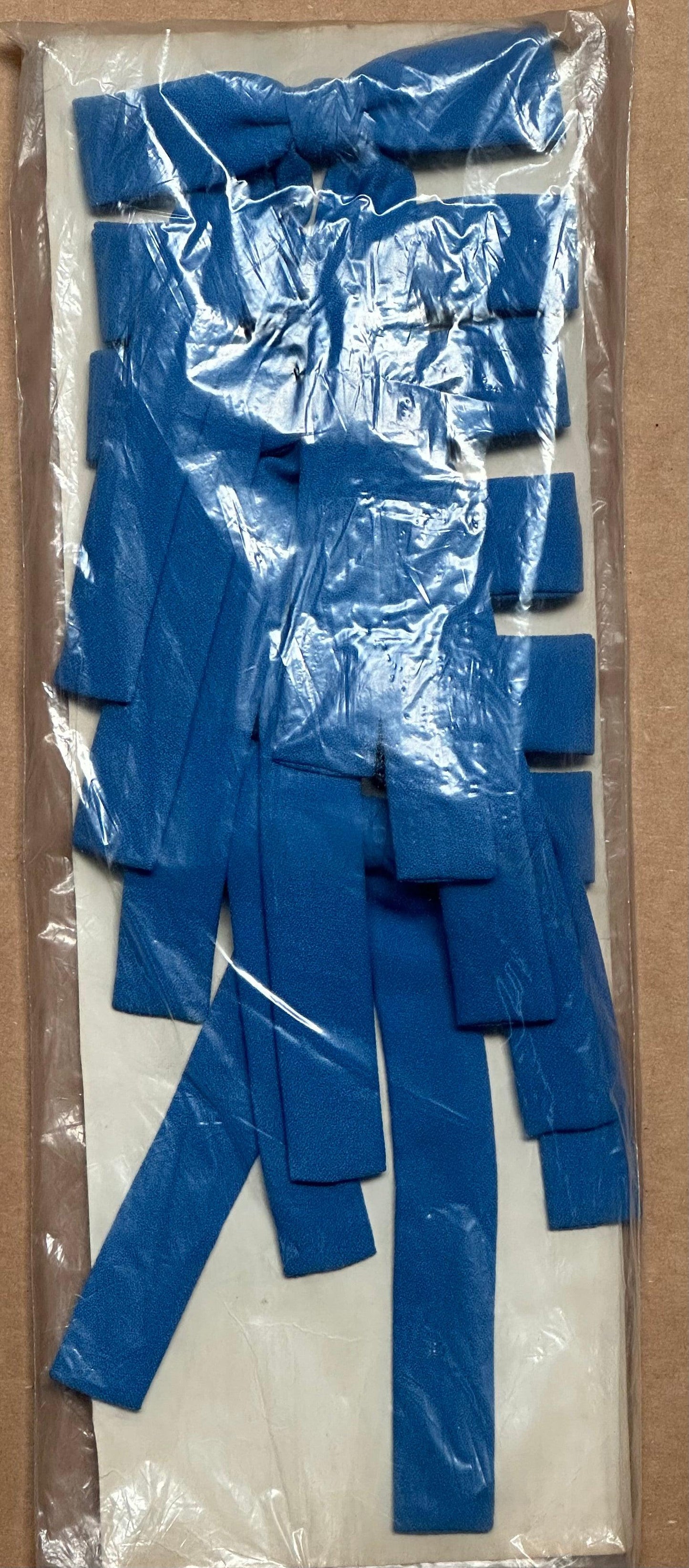 A package of Colonel Ties, designed by Square Up Fashions and reminiscent of a western look, is displayed on a white surface and wrapped in clear plastic.