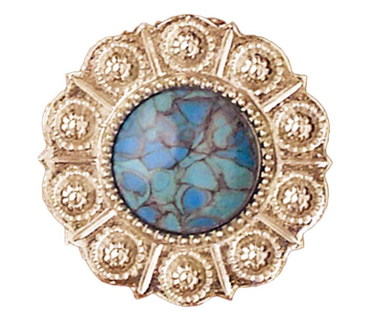 The Western Express Turquoise Scarf Slide with Scalloped Silver Edge is a circular silver-plated gold brooch with a blue-green marbled stone in the center, surrounded by intricate gold detailing and small circular patterns. Made in USA, this stunning accessory measures 1.25&quot; in diameter.