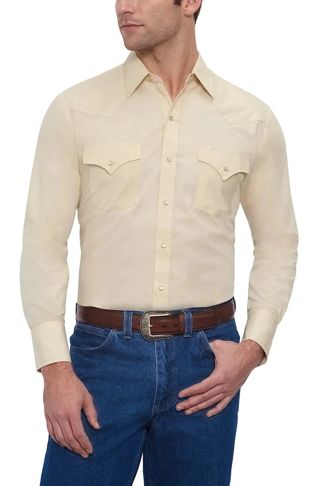 A man wearing an ELY Men's Long Sleeve Solid Western Snap Solid Shirt with Western Yokes and jeans.