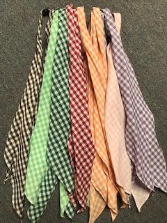 A group of CLEARANCE Gingham Scarf Ties 1/4" in different colors laid out on a carpet, readily available in stock.