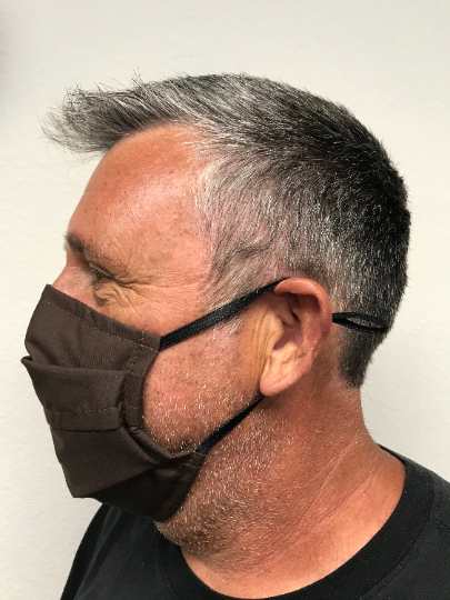 A man wearing a Square Up Fashions washable & reusable brown face mask.