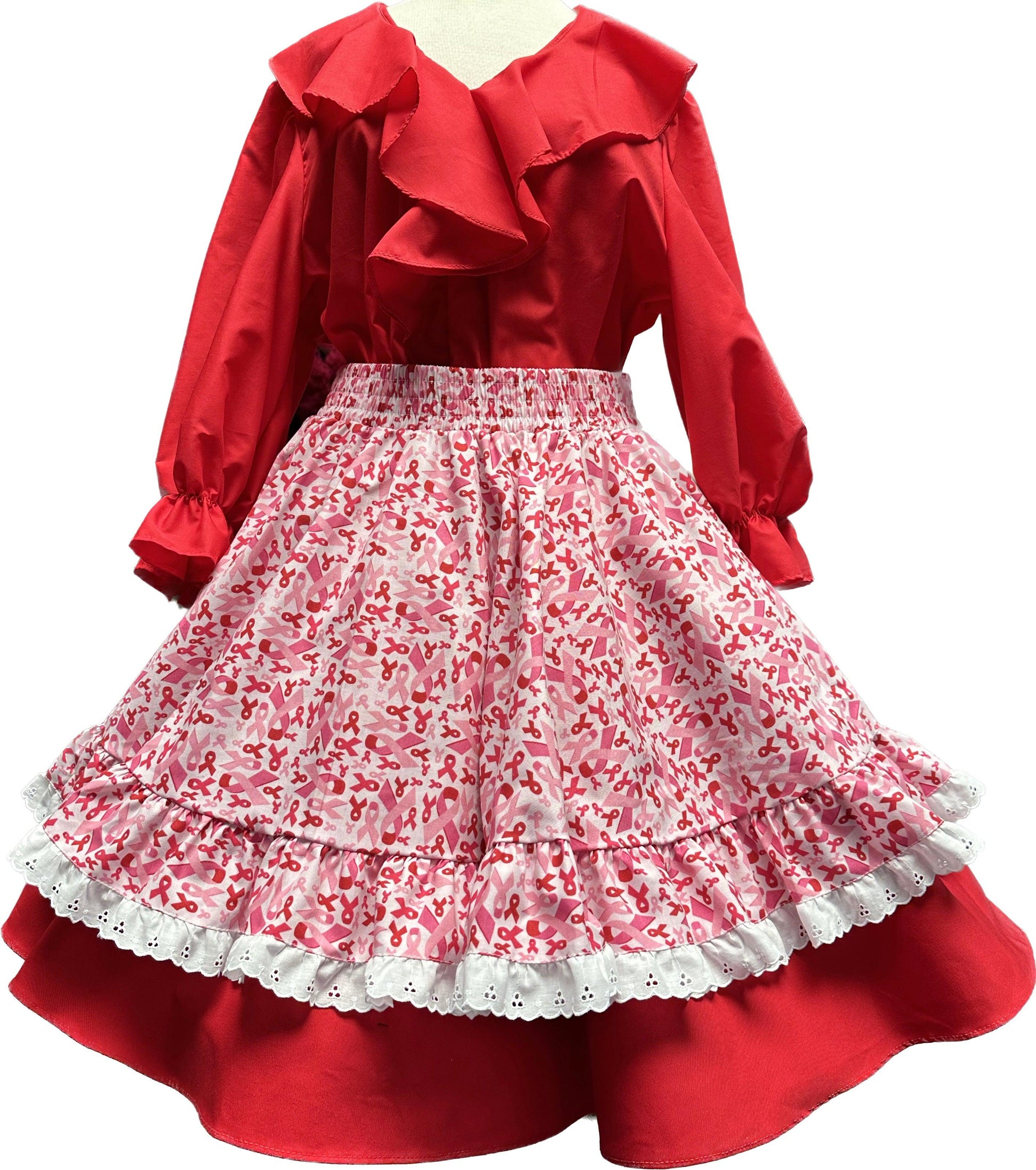 A red and white children's Pink Ribbon Apron with ruffles and Square Up Fashions ribbons.